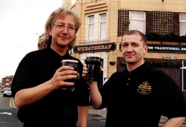 The Wheatsheaf won a new quality award as an ' Acclaimed Purveyor' of Theakston's legendary Old Peculier: Barry Eastwood, licensee (left) and Louis Veitch, bar manager.