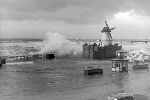 The windmill between South Pier and Central Pier ( close to the Manchester Hotel) is battered by the stormy sea in 1951