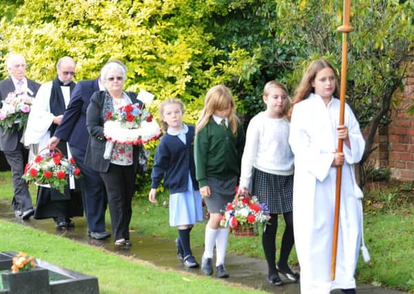 Photo: David Hurst
Service held in Holy Trinity CC Church grounds to commemoratethe 70th anniversary of the Freckleton Air Disaster
The procession with schoolchildren and survivor Mrs Ruby Currell walk down to the memorial